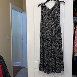 Sleeveless black and white patterned Adrianna flowy mid length dress